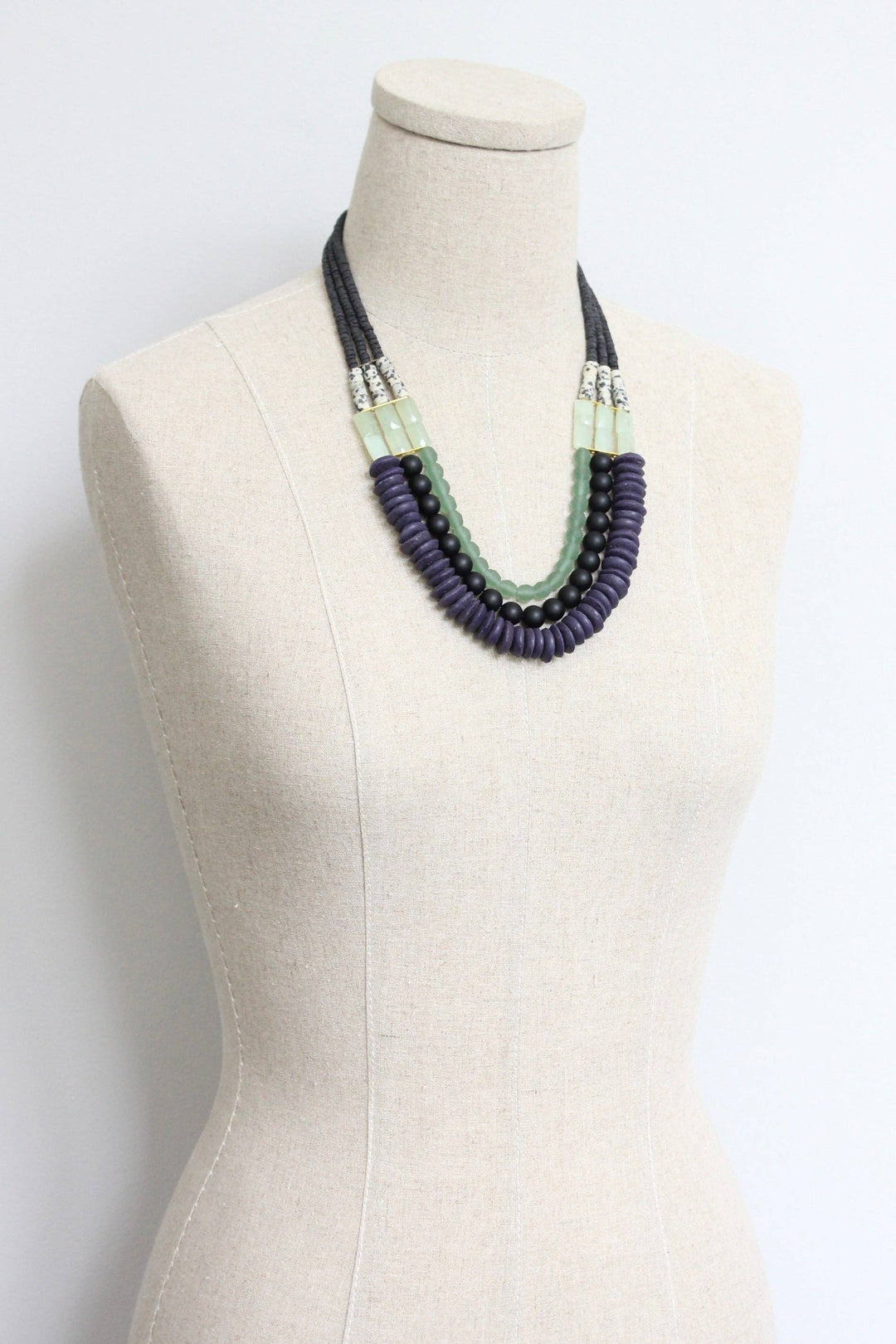 Triple strand purple and green necklace